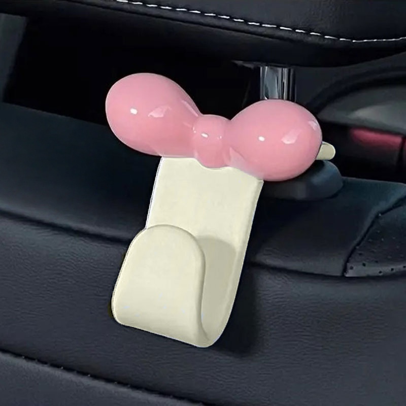 Travel Accessories In Car - ミニマリストなボウ型車用後部座席吊り下げフック、実用的な収納アクセサリー、ハンドバッグ、軽食、車内旅行用品用